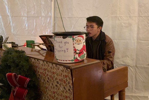 Pianist Lucas Tecson performs at Park Tavern at Christmas in the Park in downtown San Jose on Wednesday, December 11, 2024. Tecson will entertain guests with Christmas carols and other songs on December 18th and 25th from 5:30 p.m. to 7:30 p.m. (Sal Pizarro/Bay Area News Group)