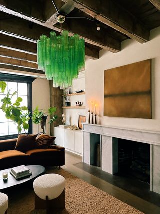 a living room with a light green glass chandelier