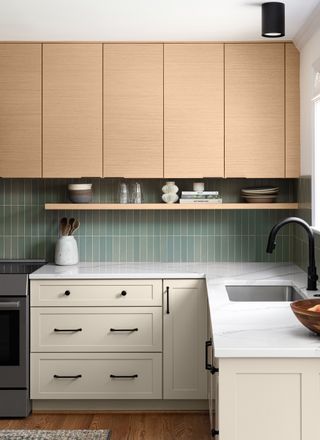 Wood kitchen cabinets with sage green vertical tile backsplash by Erika Jayne Design