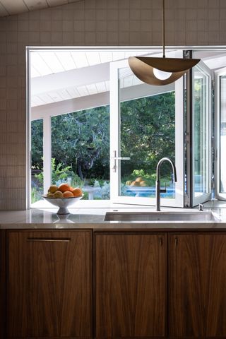 Kitchen with wooden cabinets and Japanese tiles