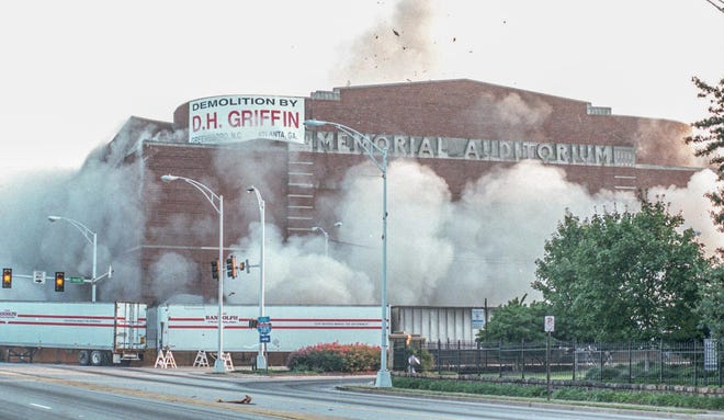 Dust flies as the old Greenville Memorial Auditorium is demolished on September 20, 1997.