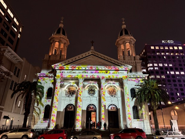 The facade of St. Joseph Cathedral Basilica in downtown San Jose, photographed on December 12, 2024, is once again illuminated for the holidays with laser projections of the artwork by Terry Estioko of Estioko Design. (Sal Pizarro/Bay Area News Group)