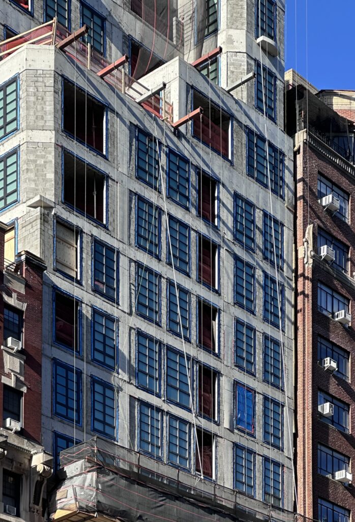 Facade installation underway at 16 Fifth Avenue in Greenwich Village, Manhattan