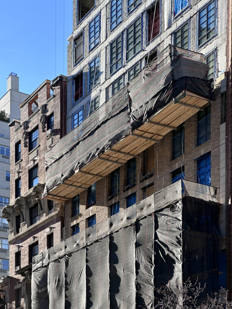 Facade installation underway at 16 Fifth Avenue in Greenwich Village, Manhattan