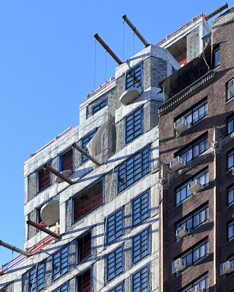 Facade installation underway at 16 Fifth Avenue in Greenwich Village, Manhattan