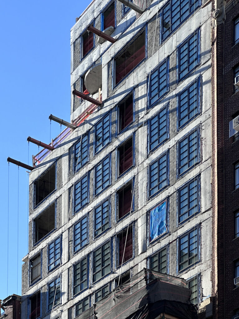 Facade installation underway at 16 Fifth Avenue in Greenwich Village, Manhattan