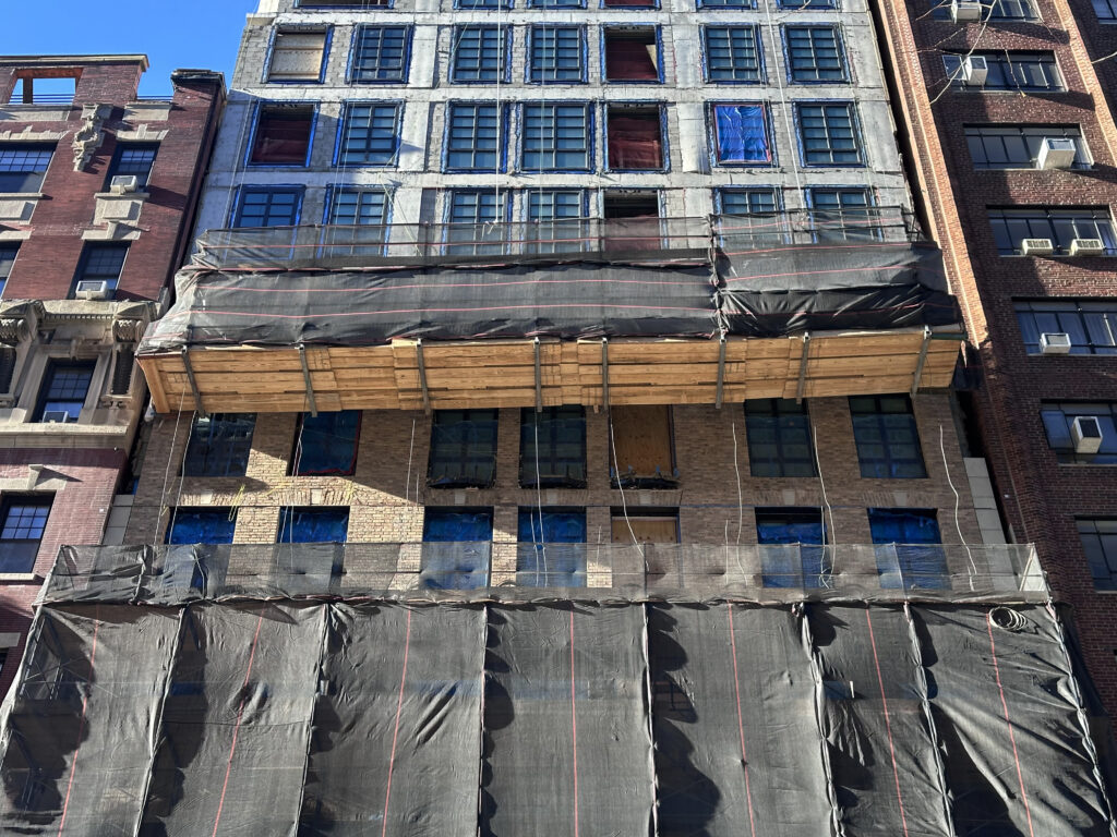 Facade installation underway at 16 Fifth Avenue in Greenwich Village, Manhattan