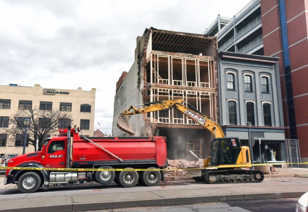 A crew member works at the former Coney Island Lunch...