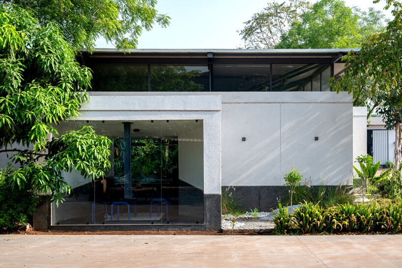 Inverted, winged hipped roof cantilevers above reconstructed office space in compartment S4