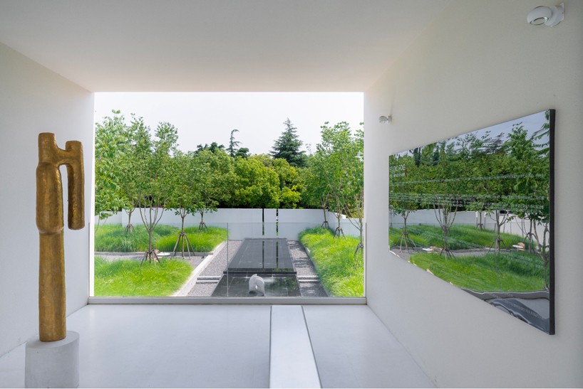 Nature invades FG Studio's wild garden gallery, which transforms a former farmhouse in Shanghai