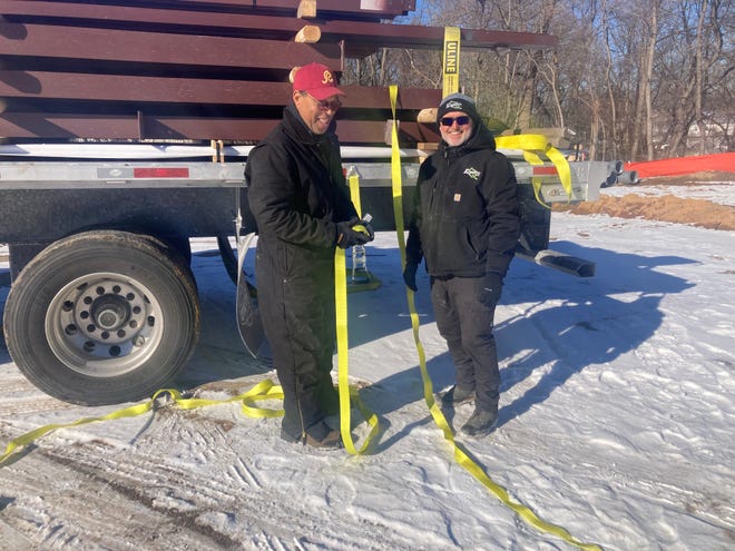 Elements Landscaping owner Larry Fulford, right, with truck driver Rocky Harrell, on Thursday, Jan. 9, 2025, at the site of the local company's new headquarters on Levittown Parkway. Harrell provided a large pole barn to house landscaping equipment.