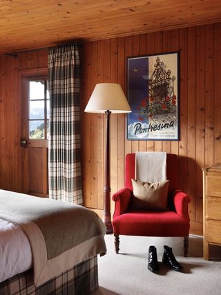 a wooden bedroom in a chalet