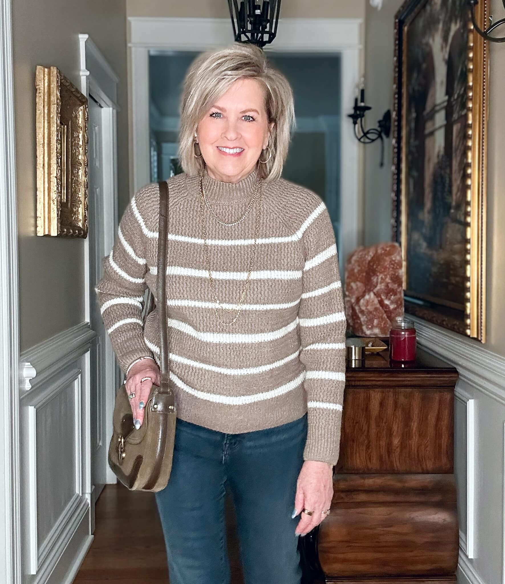 Tania Stephens wears a striped mocha sweater and jeans