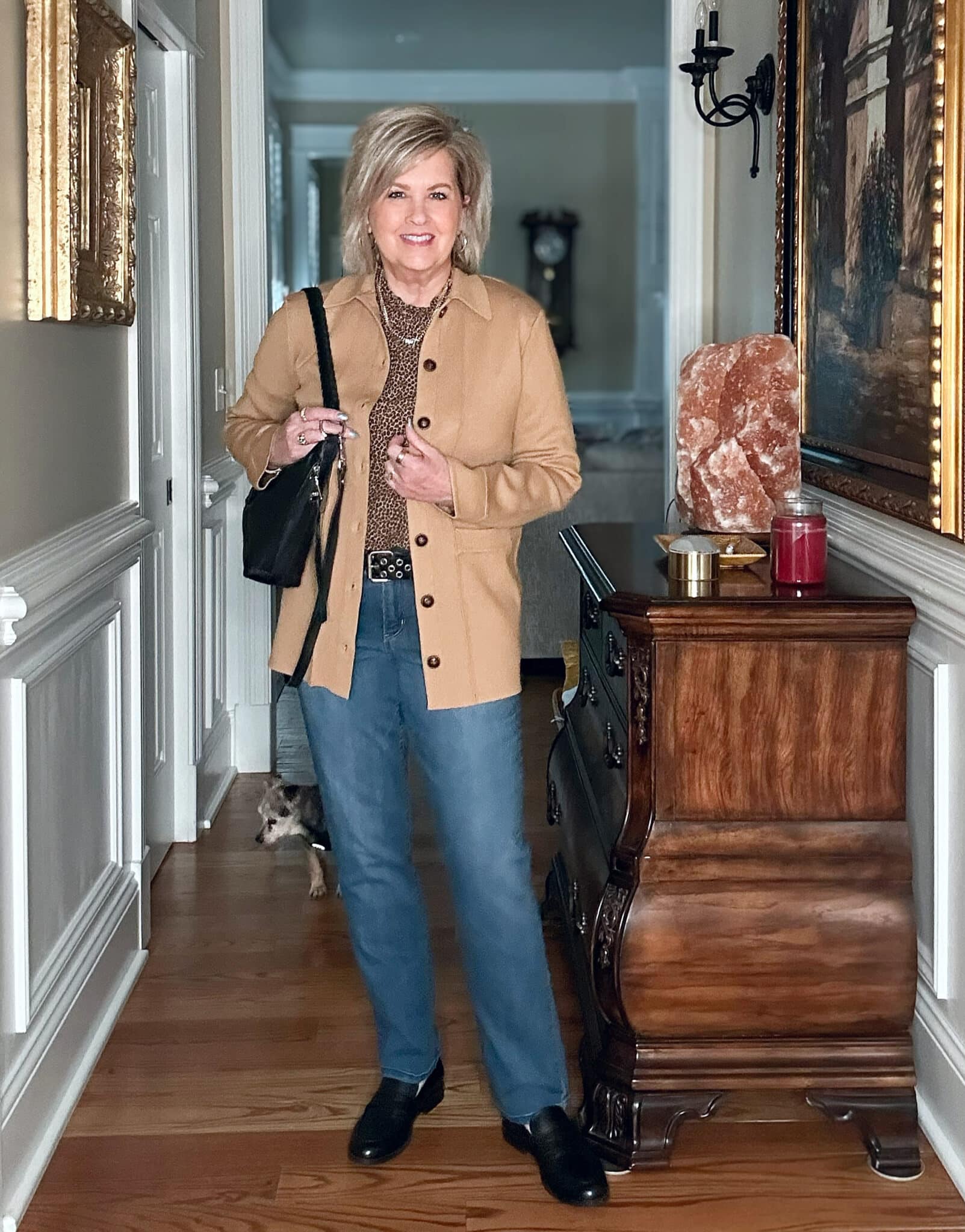 Tania Stephens wears a leopard print top, camel blazer and jeans