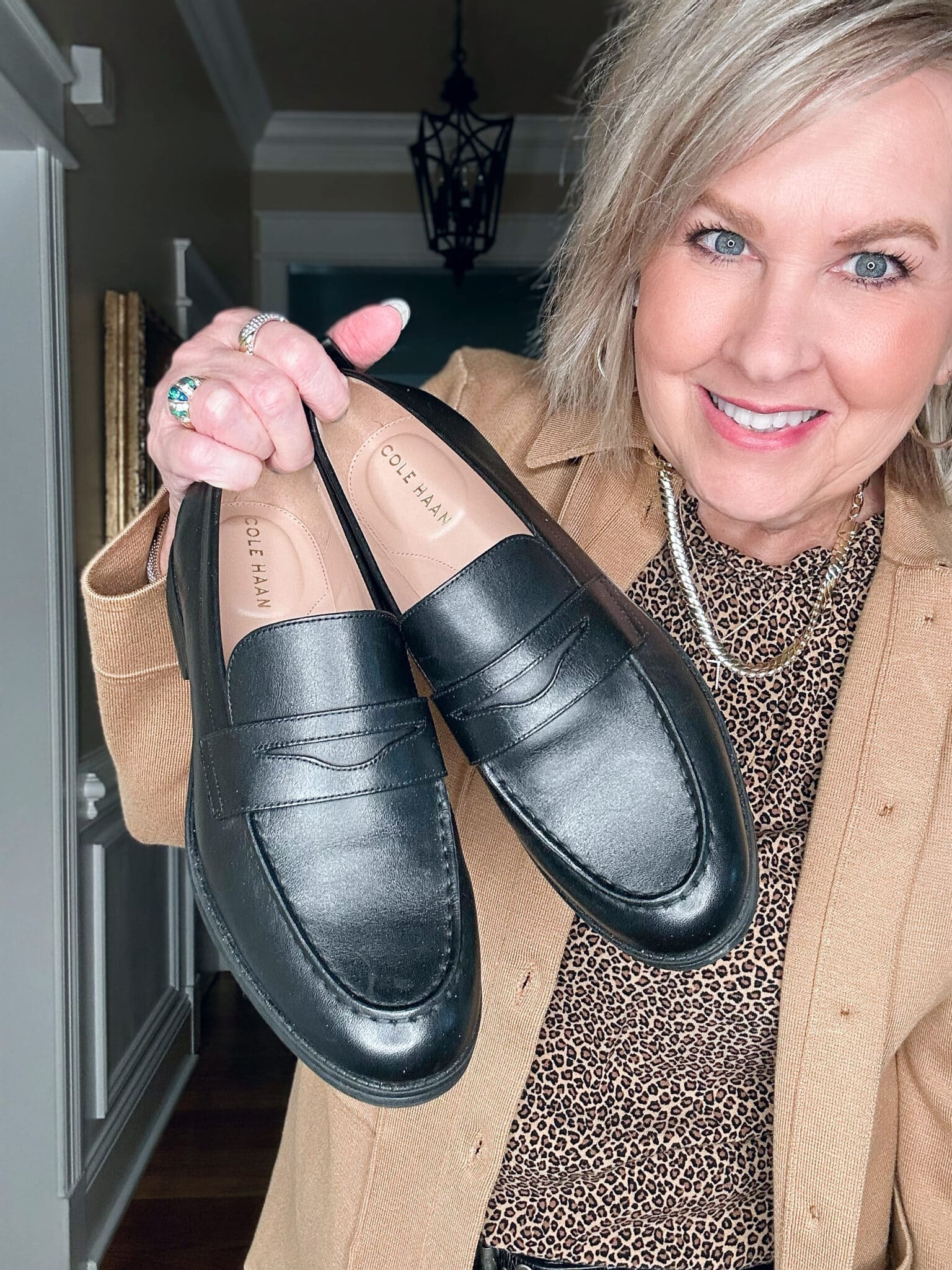 Tania Stephens wears a camel knit blazer and Cole Hann loafers