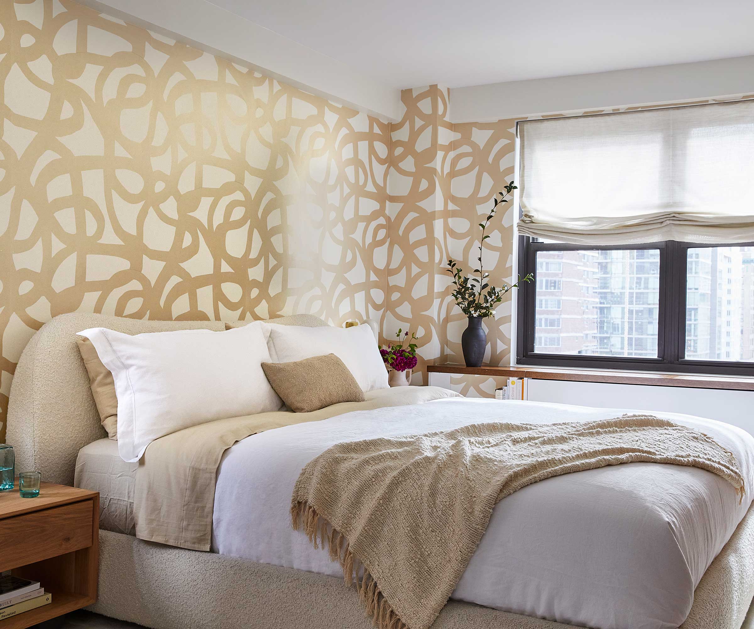 Neutral bedroom with gold patterned wallpaper