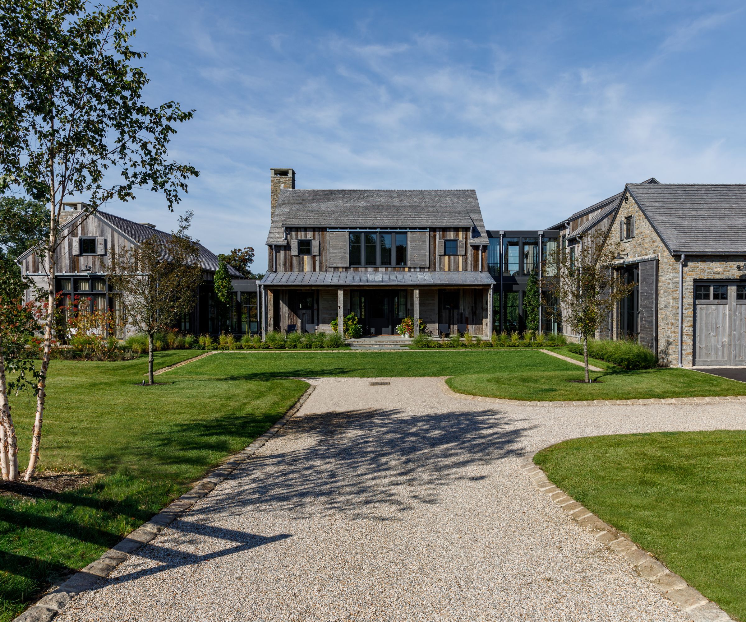 The exterior of a wooden and stone house in the mountains