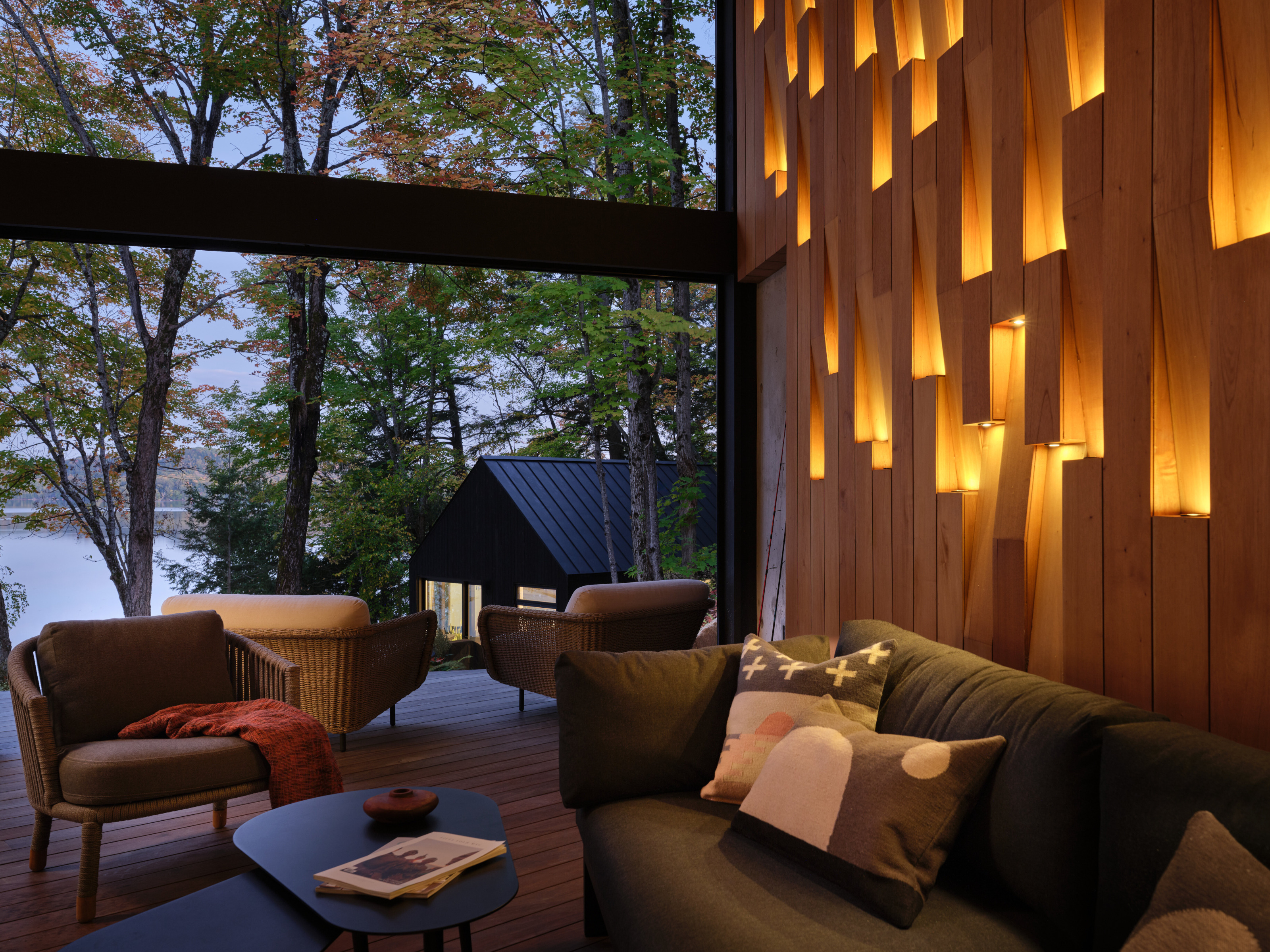 In the Muskoka room, looking past the sleeping hut to the lake beyond