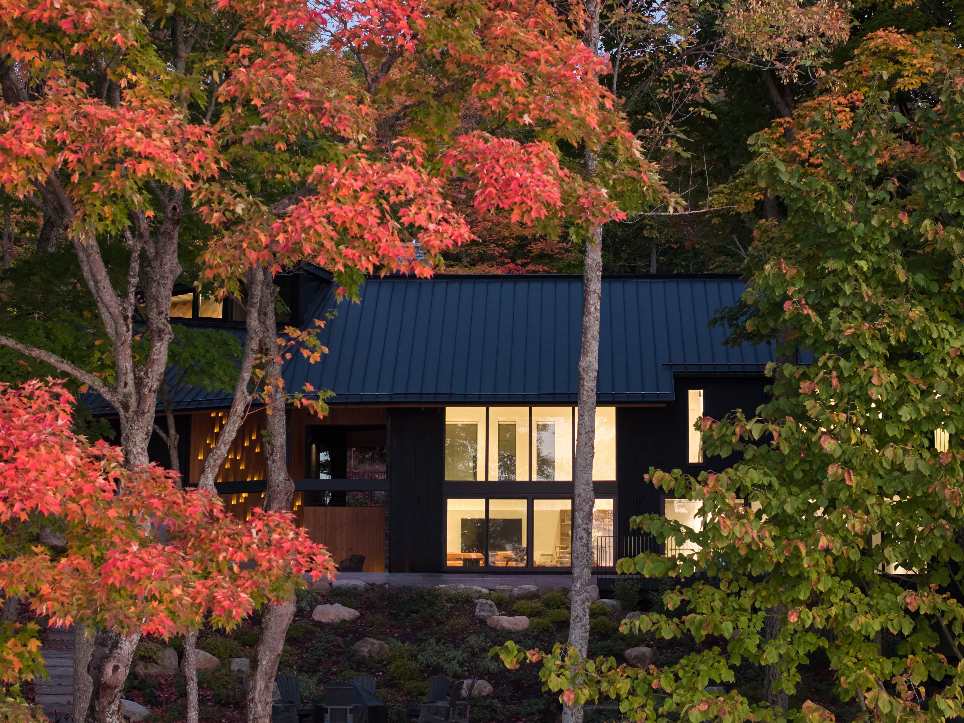 The main living space seen from the shore of the lake