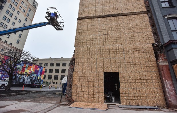 A crew member works at the former Coney Island Lunch...