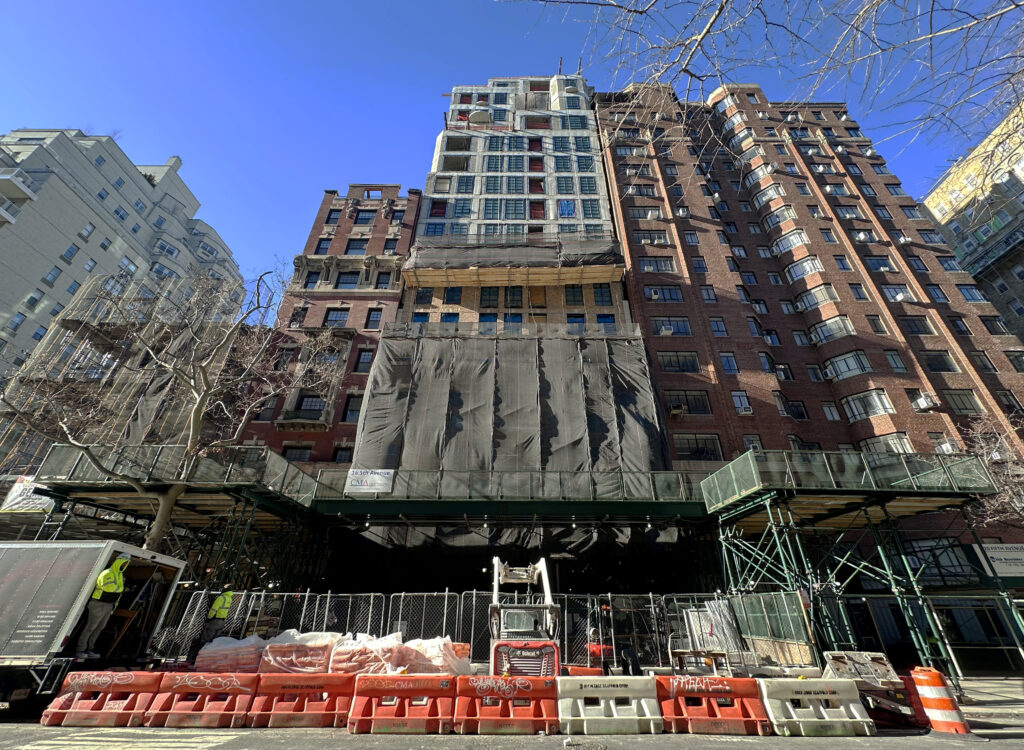 Facade installation underway at 16 Fifth Avenue in Greenwich Village, Manhattan