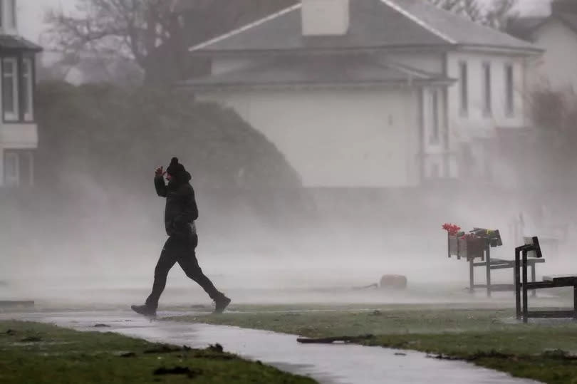 Man walks in the storm Eowyn