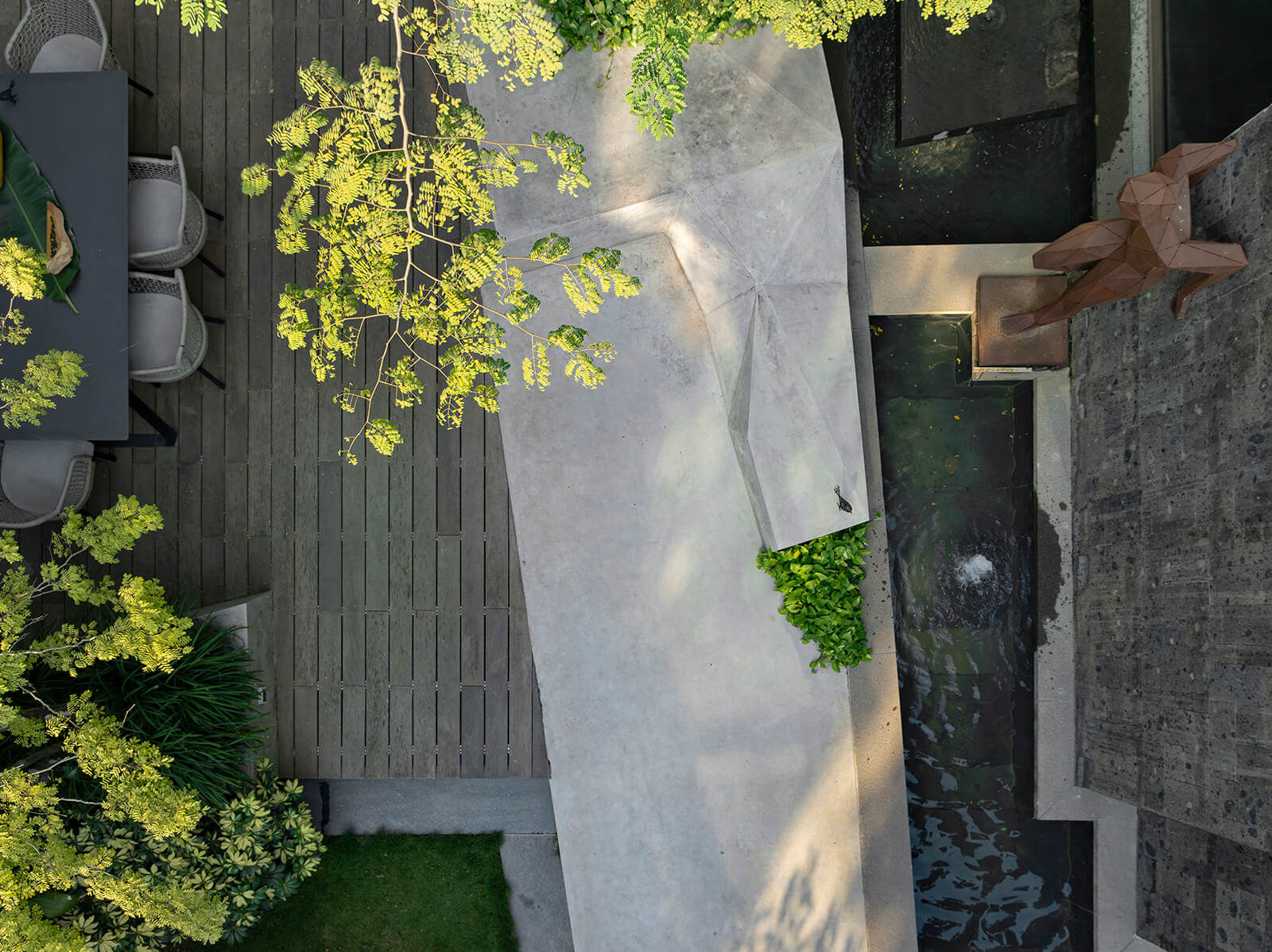 Granite and green frame the inviting terrace design | Origami House | Kiasma Studio | Vocal world