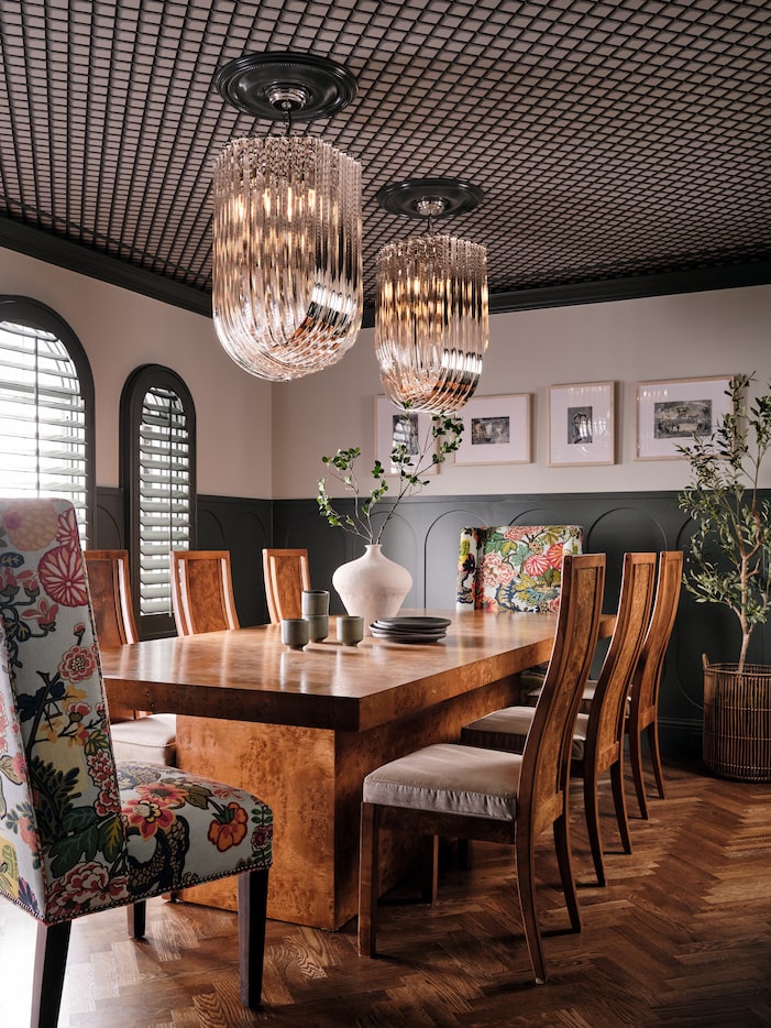 The lighting and wallpaper ceiling of the dining room create a breathtaking focus.