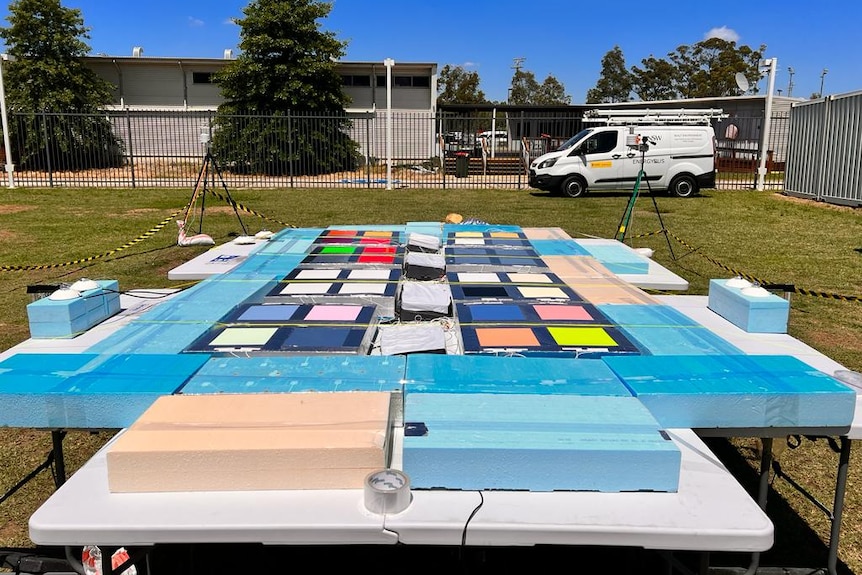 A table with 32 squares in full sunlight, cameras that point to the table in a courtyard.