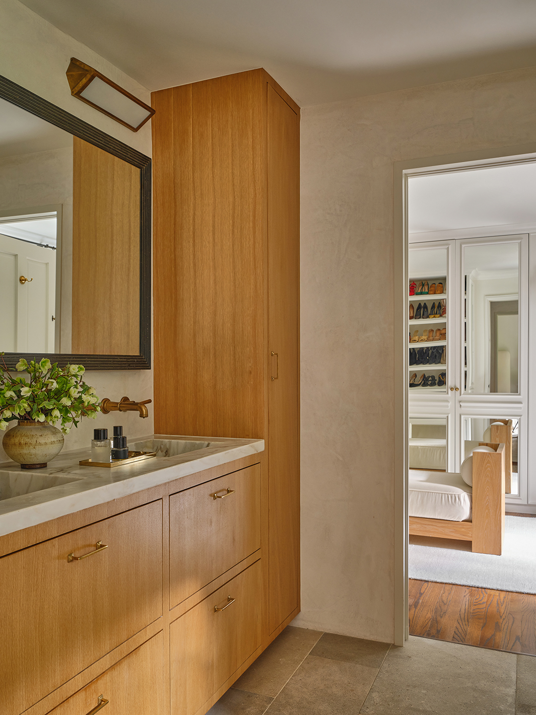 Primary bath with a view of the closet