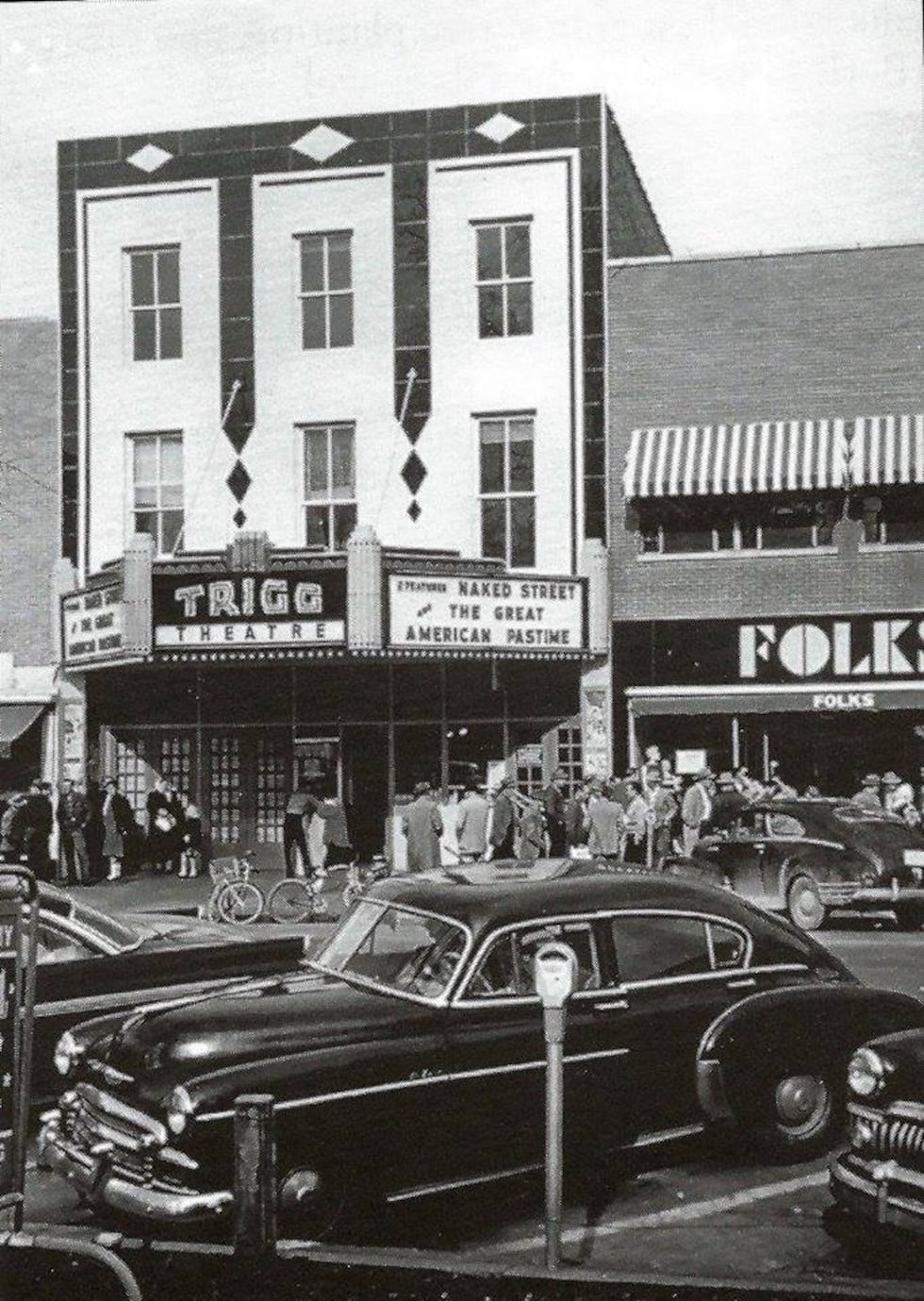 The Trigg theater in its flowering shows its legendary marquee and vitrolite facade, once a ...