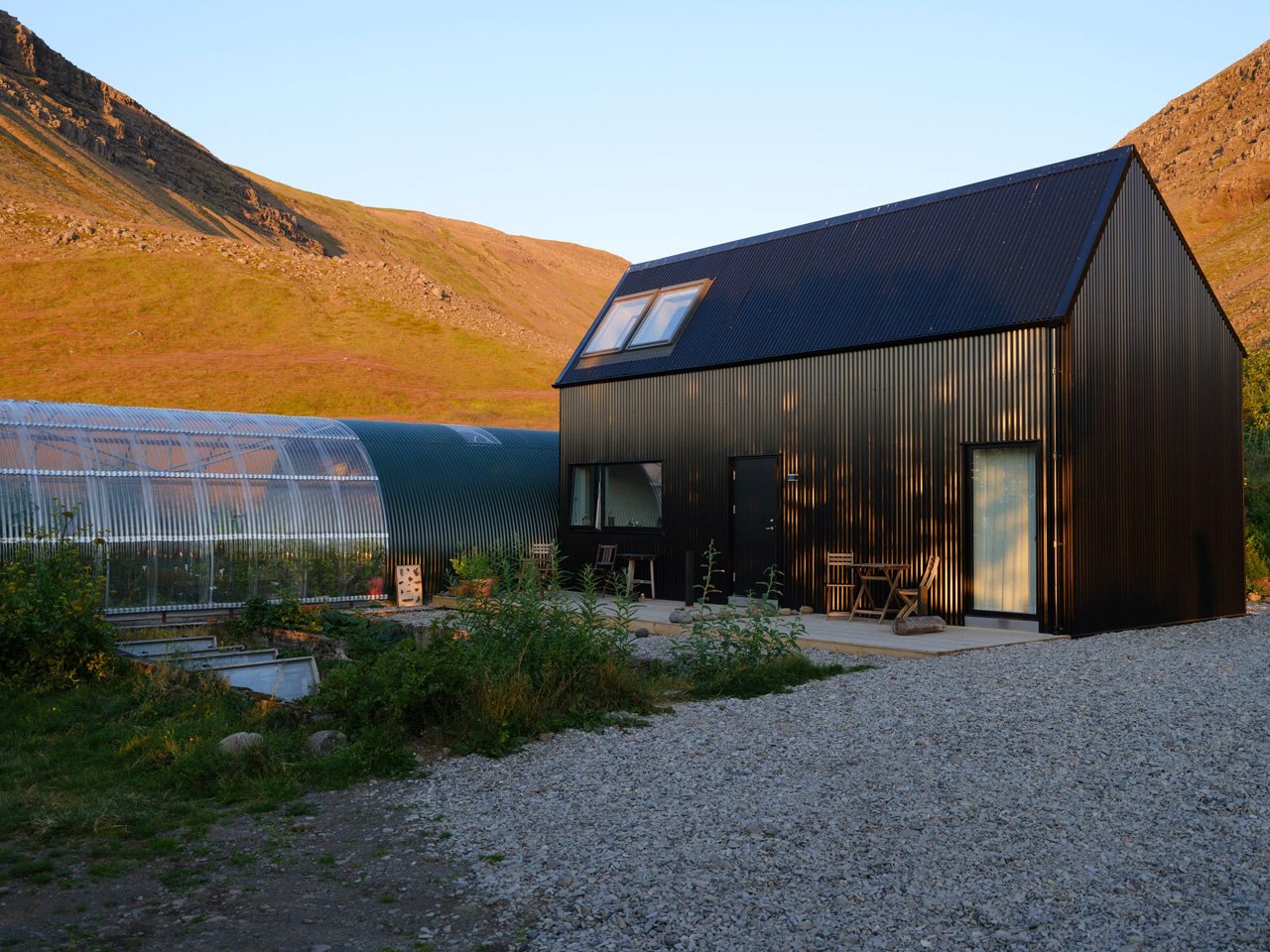 This sustainable jet black cabin combines art and hospitality in the remote landscapes of Iceland