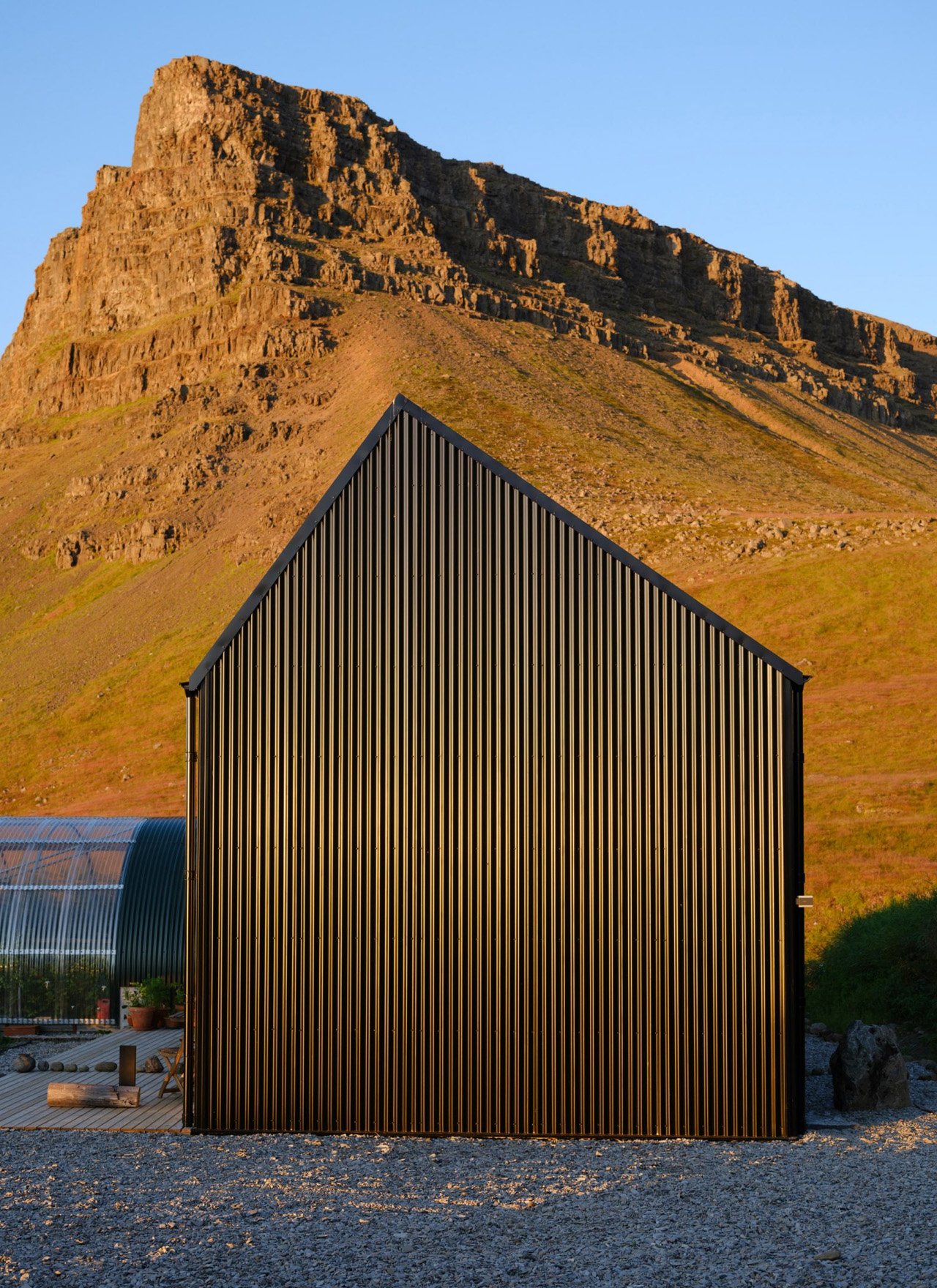 This sustainable jet black cabin combines art and hospitality in the remote landscapes of Iceland