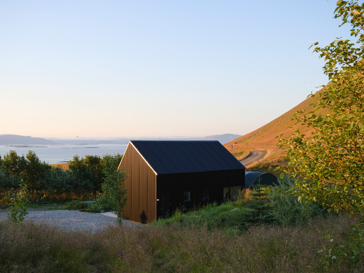 This sustainable jet black cabin combines art and hospitality in the remote landscapes of Iceland