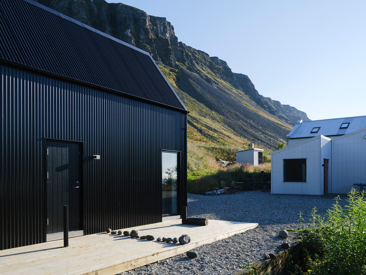 This sustainable jet black cabin combines art and hospitality in the remote landscapes of Iceland