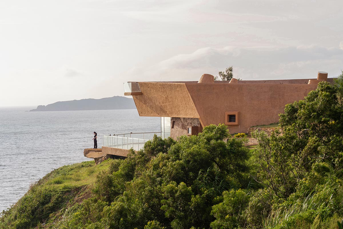 A gallery on a cliff has irregularly shaped lighting pipes that imitate creatures in China Marine