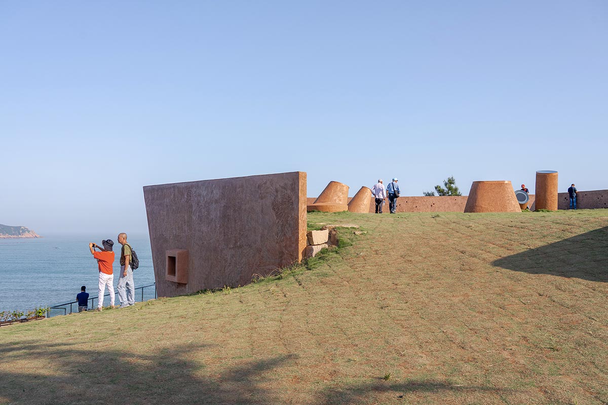 A gallery on a cliff has irregularly shaped lighting pipes that imitate creatures in China Marine