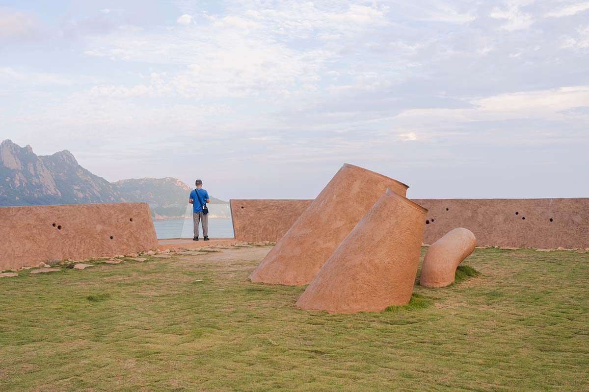 A gallery on a cliff has irregularly shaped lighting pipes that imitate creatures in China Marine