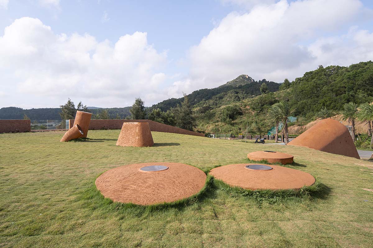 A gallery on a cliff has irregularly shaped lighting pipes that imitate creatures in China Marine