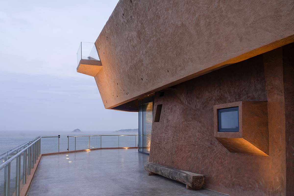 A gallery on a cliff has irregularly shaped lighting pipes that imitate creatures in China Marine