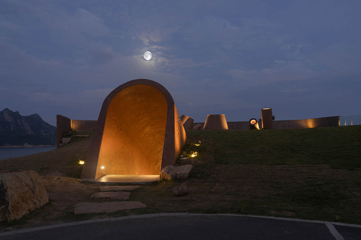 A gallery on a cliff has irregularly shaped lighting pipes that imitate creatures in China Marine