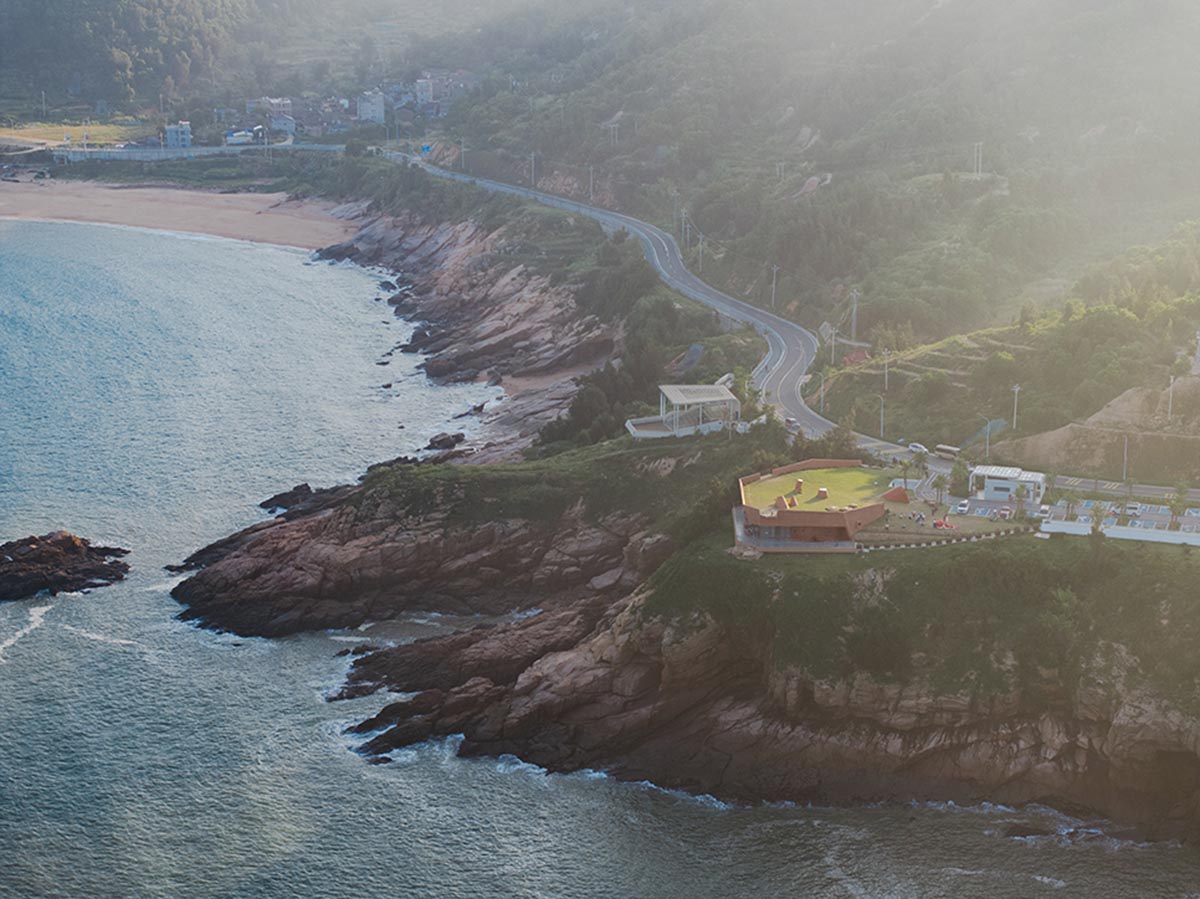 A gallery on a cliff has irregularly shaped lighting pipes that imitate creatures in China Marine