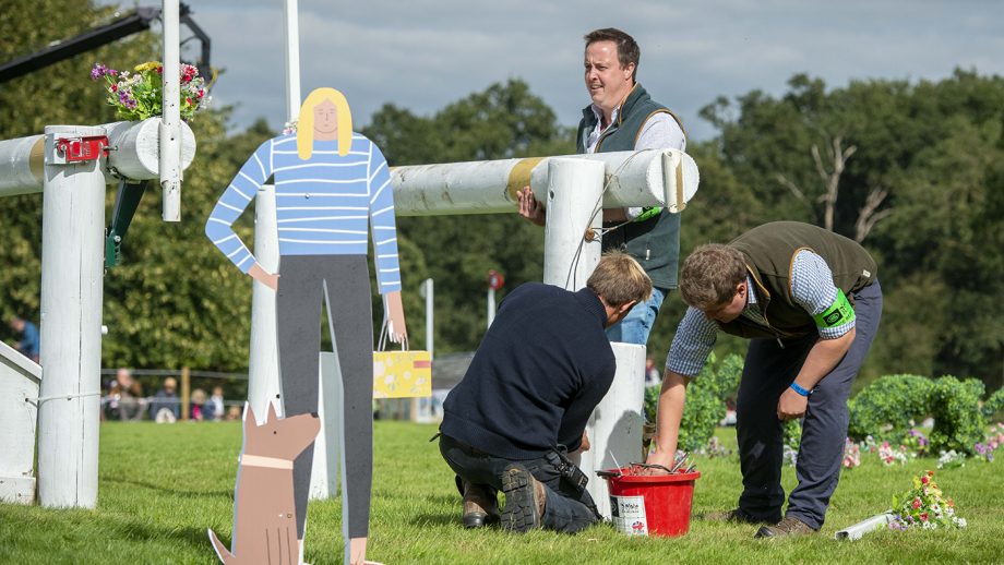 Frangible fences: Course builders who repair a frangible pen on a running fence.