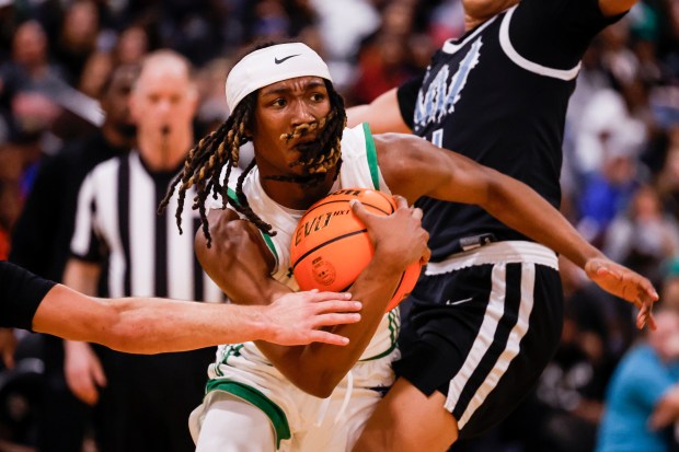 Kass Jackson (5) from Green Run carries the ball as he moves towards the edge. Green Run defeated Woodside 39-34 in the semi-finals of class 5 at the Ocean Lakes High School in Virginia Beach, Virginia, on March 7, 2025 (Billy Schuerman / The Virginian Pilot)