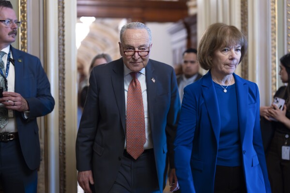 The chairman of the Senate Minister, Chuck Schumer, DN.Y., left with Senator Tina Smith, D-Minn.