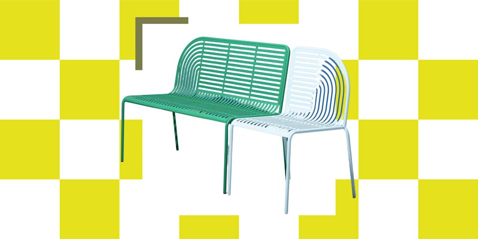     Image of a green and light blue metal garden bench on a white and yellow chess brette background. 