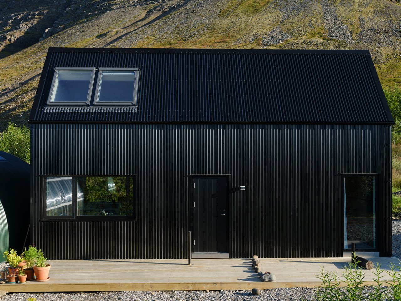 This sustainable jet black cabin combines art and hospitality in the remote landscapes of Iceland