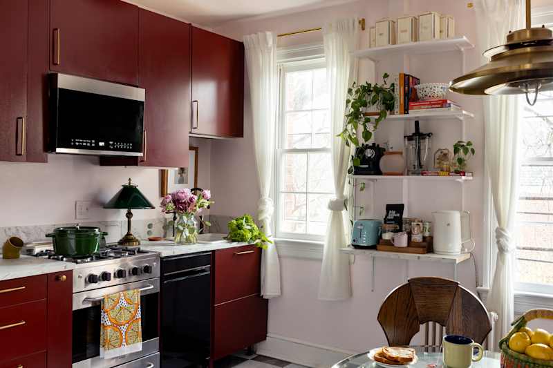 Burgundy painted cupboards in a newly renovated kitchen.