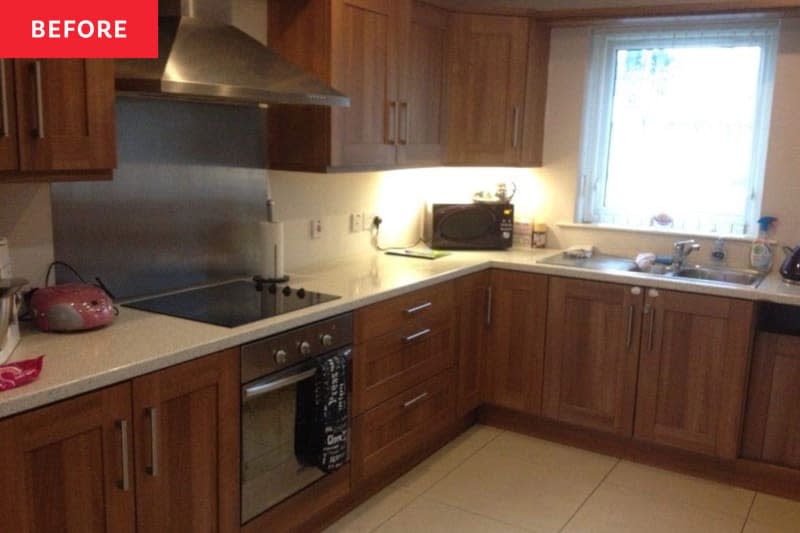 Kitchen before the renovation. Many wooden cabinets, dark, no real color