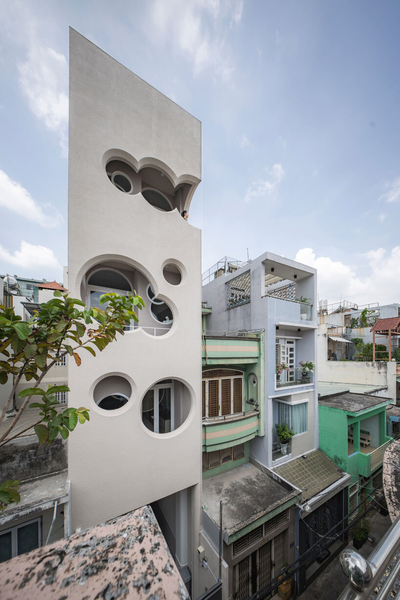 Cloud-shaped openings Pierce Urban co-life unit concrete facade in Vietnam